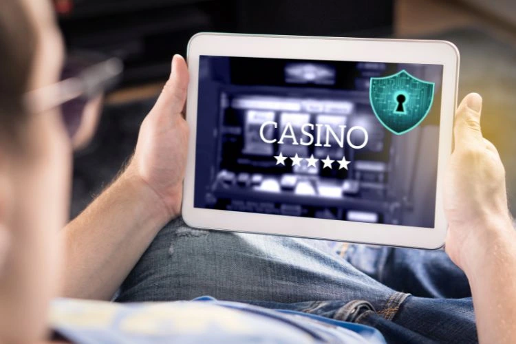 Man playing on a tablet at a secure online casino with data protection