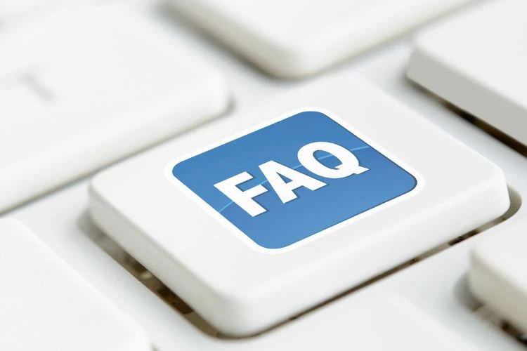 Blue keyboard key with the inscription FAQ, symbol of frequently asked questions about online casinos